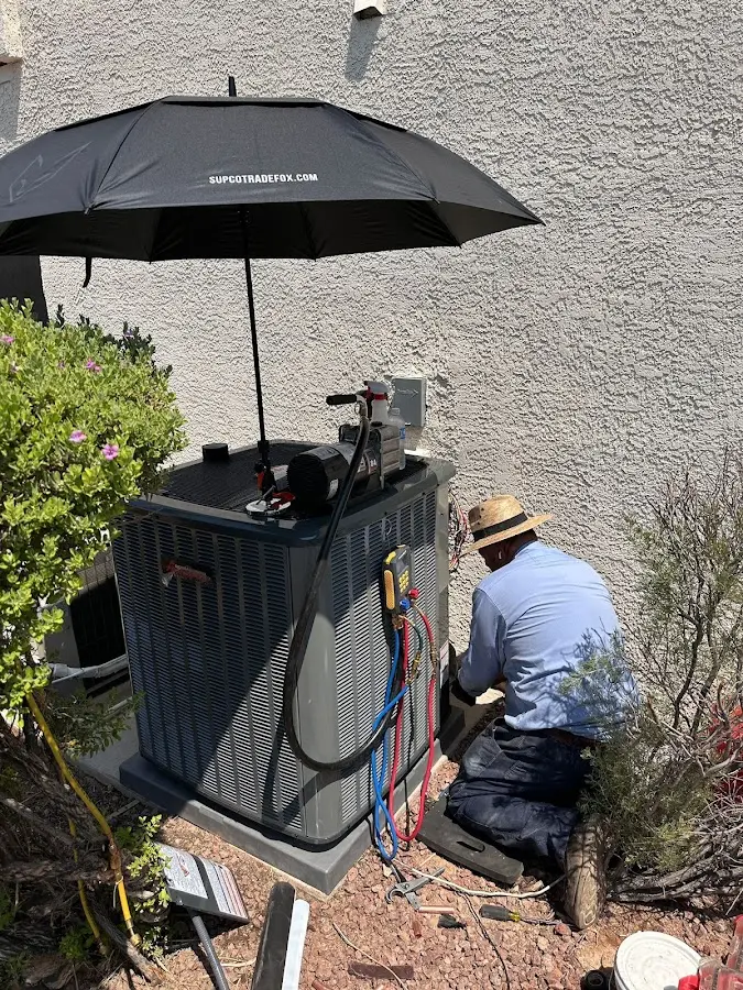 HVAC technician performing outdoor AC maintenance in Strongsville